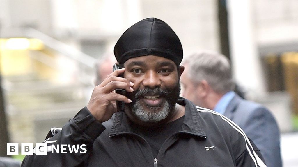 Boxing trainer who brought gun to UK sentenced