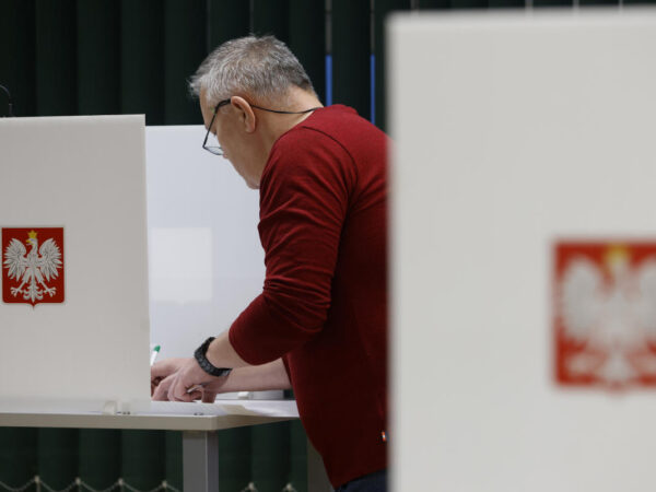 Poles vote in a high-stakes election that will determine whether right-wing party stays in power