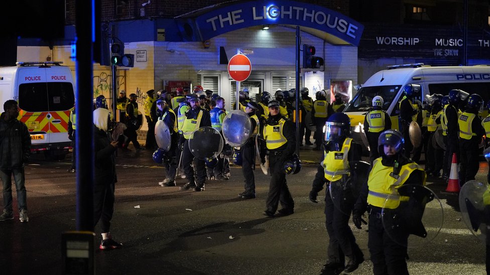 Four police officers injured in south London clash