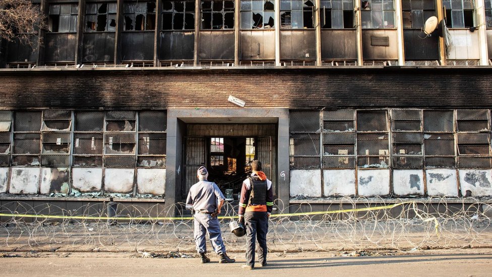 Man held for murder over South Africa building fire Man held for murder over South Africa building fire