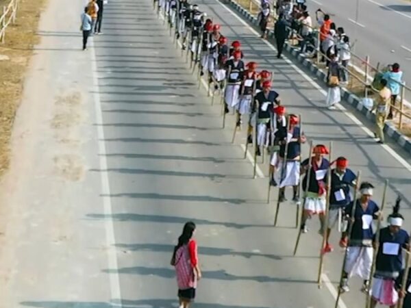 721 members of India’s Karbi community walk on stilts for world record