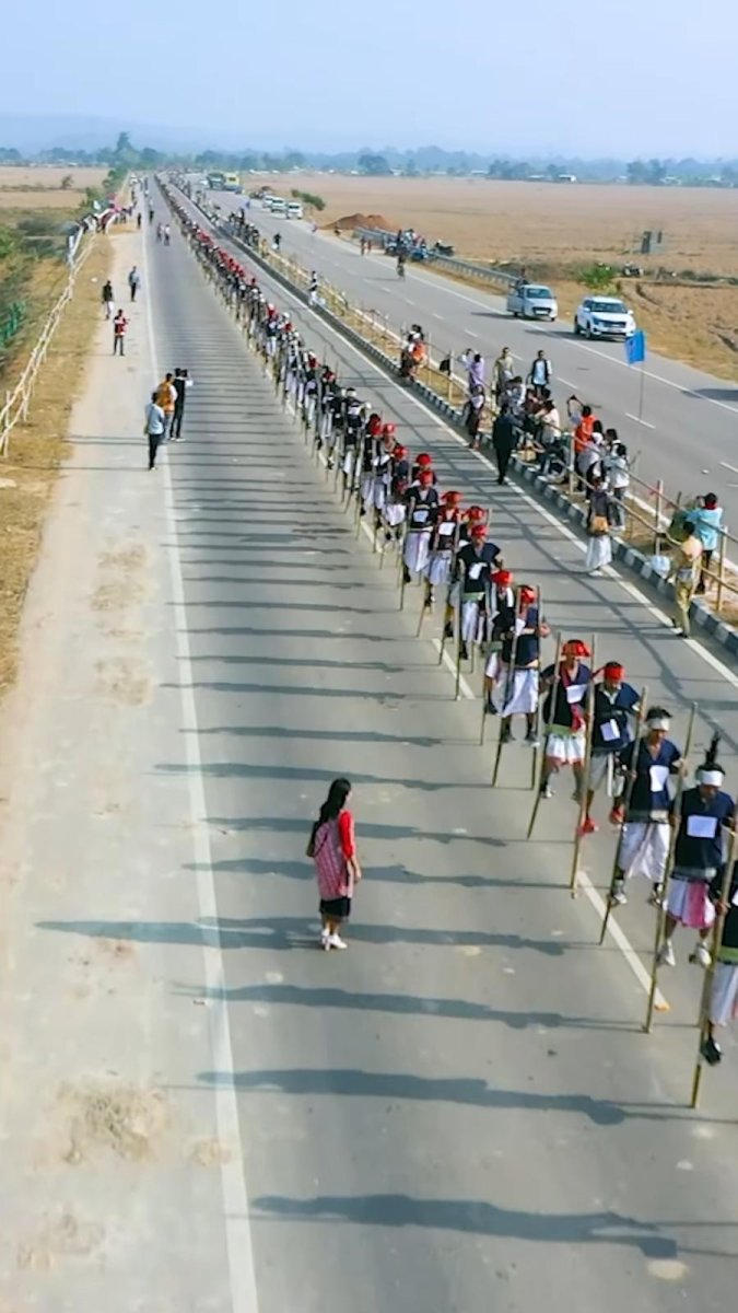 721 members of India’s Karbi community walk on stilts for world record 721 members of India’s Karbi community walk on stilts for world record