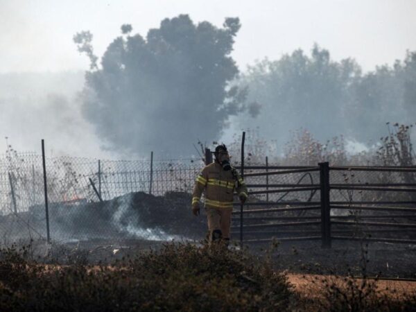 Hezbollah fires dozens of rockets into Israel after strike kills commander