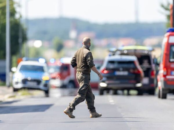 Three held after shots heard in refugee centre in southern Germany