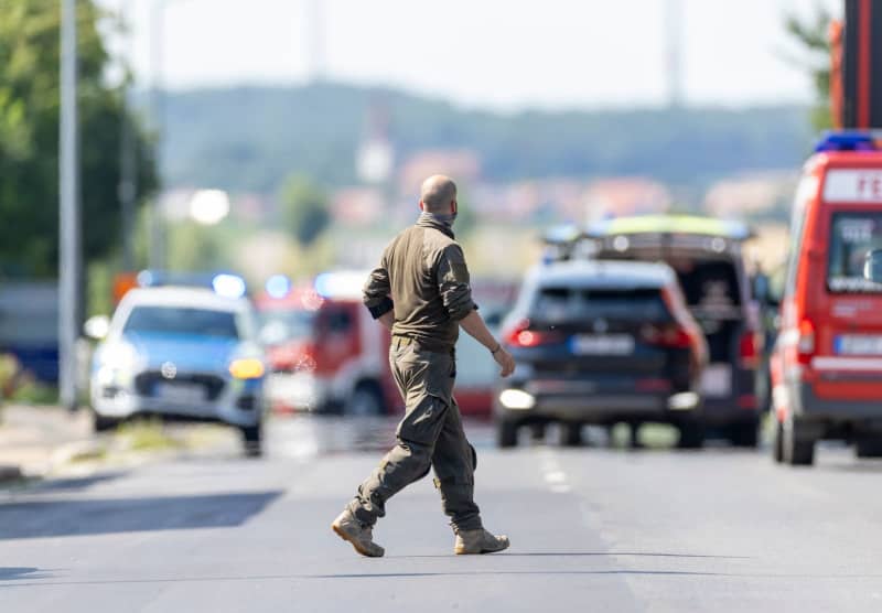 Three held after shots heard in refugee centre in southern Germany Three held after shots heard in refugee centre in southern Germany