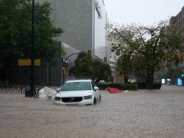 Is it safe to travel to Spain and should I cancel my holiday after flooding disaster?
