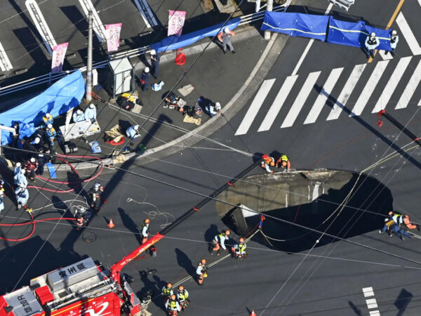 Swimming pool-sized sinkhole swallows truck in Japan, trapping driver inside