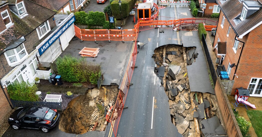 Large Holes Open Up in Surrey, England; Car Teeters on the Edge Large Holes Open Up in Surrey, England; Car Teeters on the Edge