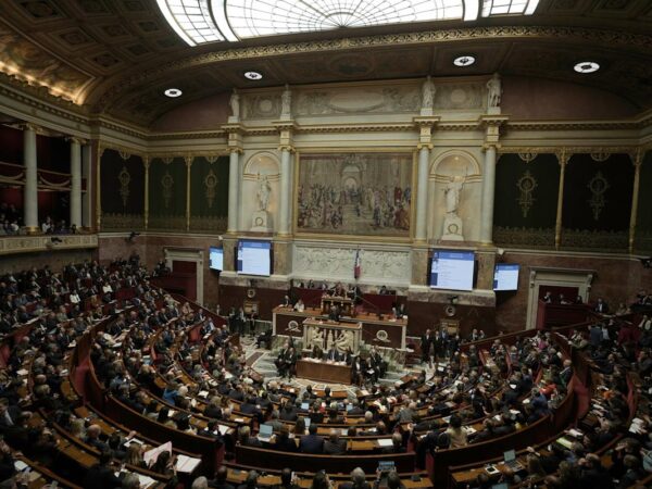 French lawmaker who uses a wheelchair wins a change in voting rules that discriminated against him